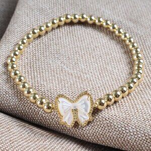 Haley Bow Gold Mother-of-Pearl Stretch Bracelet by Kendra Scott